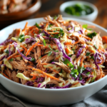 "Delicious coleslaw recipe for pulled pork, creamy and tangy, served alongside smoky pulled pork."