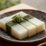 "Yokan slices on a plate, a traditional Japanese dessert made from red bean paste and agar-agar."